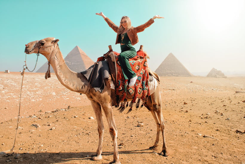 Woman Riding Camel