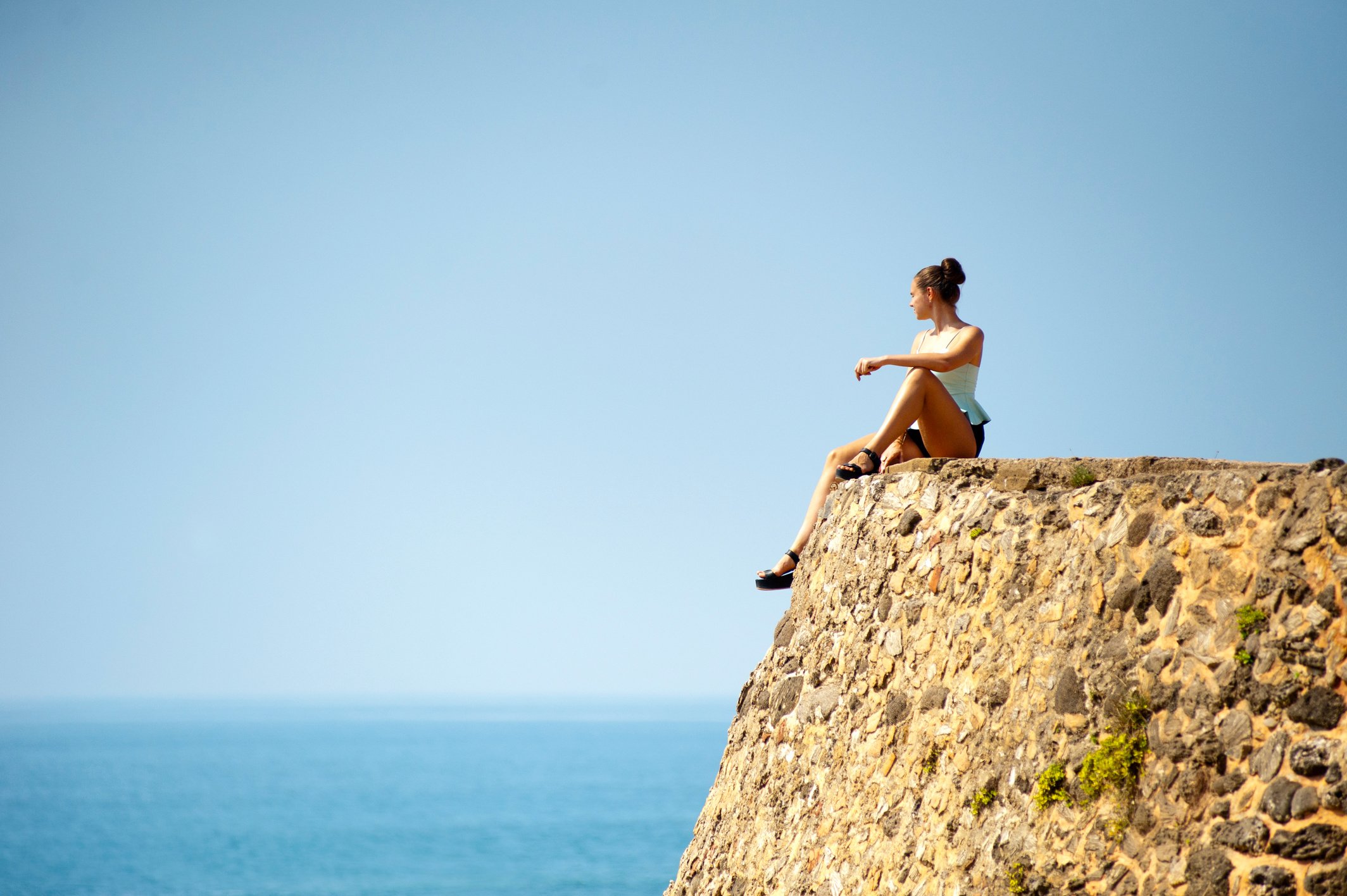 Woman Sitting on Edge